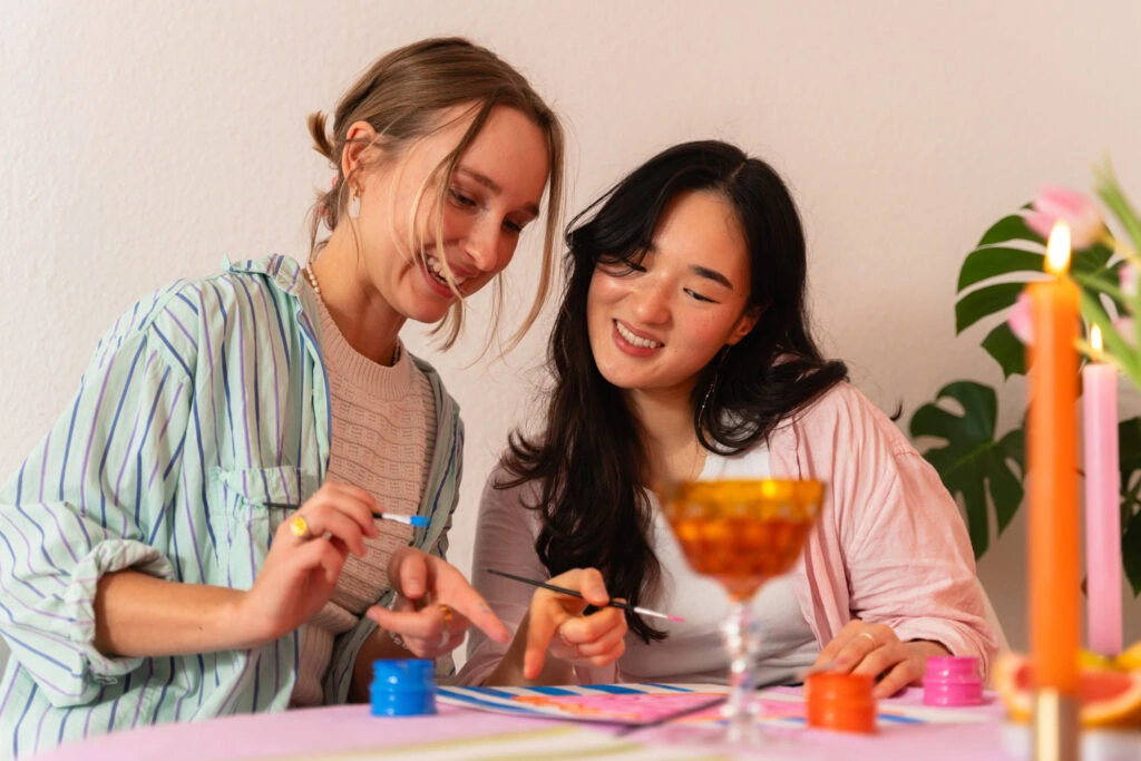Hannah and Nina painting at a MuseDuo event