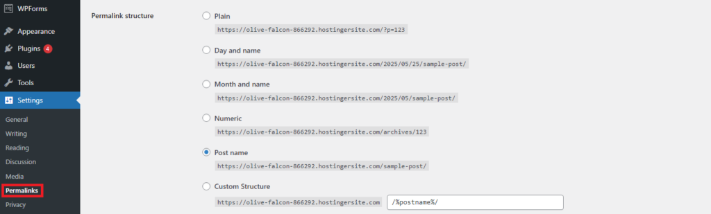 WordPress settings menu displaying permalink structure options: Plain, Day and name, Month and name, Numeric, Post name, Custom Structure.