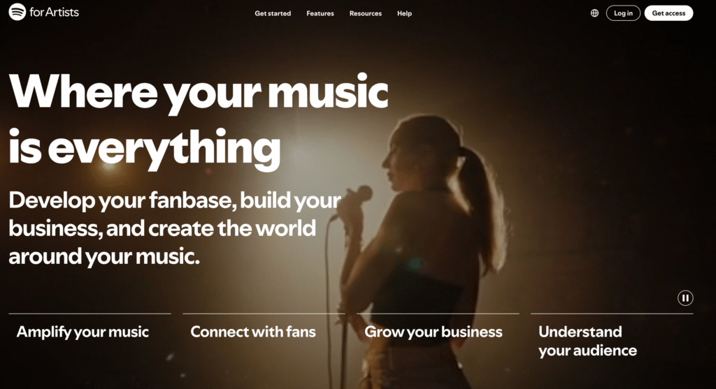 A singer performs on stage with dramatic lighting, promoting Spotify for Artists and its features for musicians.